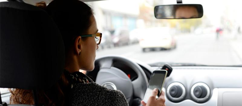 Woman texting and driving