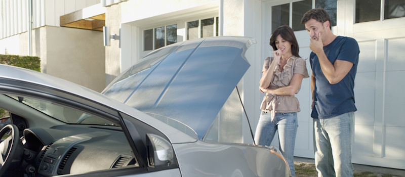 Couple with a stalled car