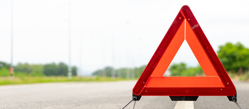 Triangle reflector on the side of the road