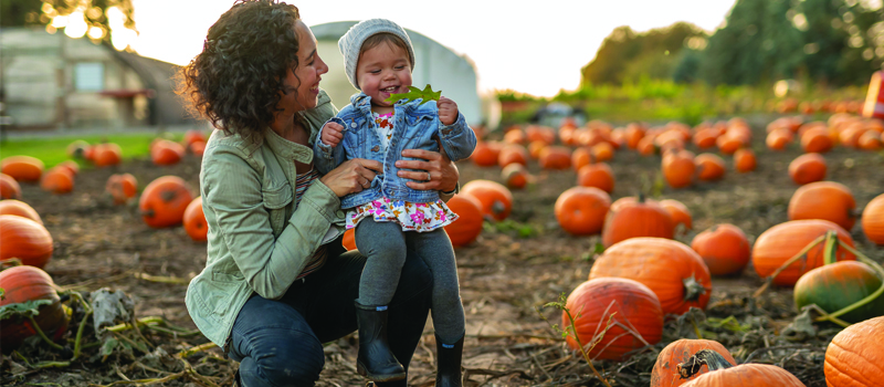 Mother and daughter in a pumpkin patch
