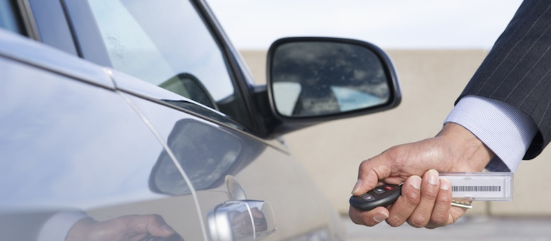 Man unlocking rental car