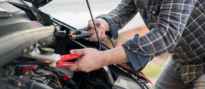 Man using jumper cables