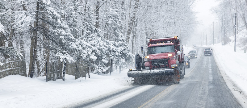 Truck scraping an icy road