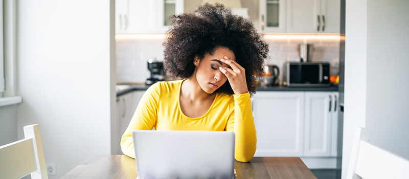 Tired woman with her laptop