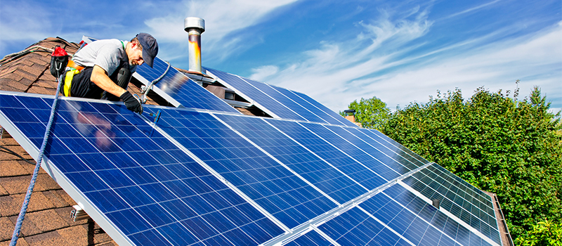 Man installing solar panels